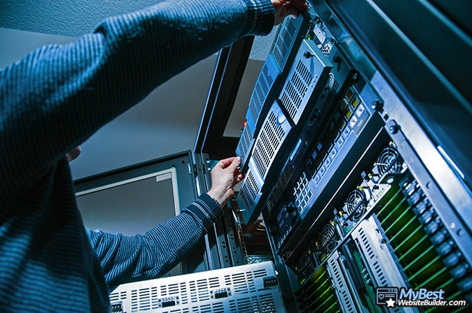 Best cloud hosting: a man fixing a server fault.