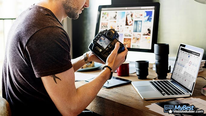 Photography websites: a man working in his camera. Photography websites: a man working in his camera.