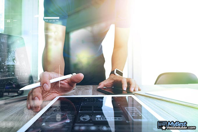 Website layouts: a man designing a website layout. Website layouts: a man designing a website layout.